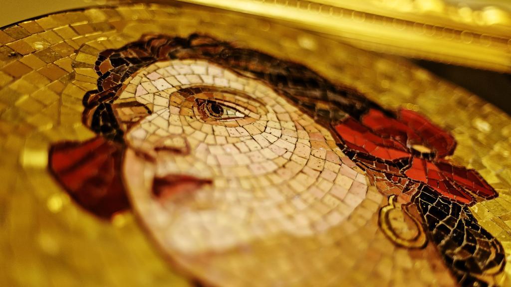 Grandezza Hotel Luxury Palace Brno Exterior photo Detail of the face of the figure of the Virgin Mary